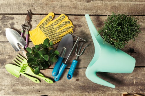 Gardener with tools in a Stoke Newington garden