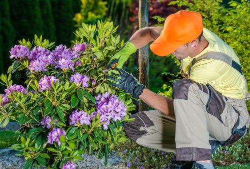 Supervisor completing incident report during a garden maintenance task